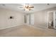 Spacious bedroom with a ceiling fan and natural light coming through the windows at 826 Warwick Ct, Burlington, NC 27215
