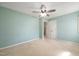 This bedroom features light green walls, carpeted floor, and a ceiling fan at 826 Warwick Ct, Burlington, NC 27215