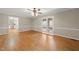 Spacious dining room with hardwood floors, adjacent to the kitchen area through glass french doors at 826 Warwick Ct, Burlington, NC 27215