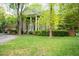 Brick home with a two car garage and white pillars at the front entrance at 826 Warwick Ct, Burlington, NC 27215