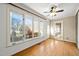 Sunroom bathed in natural light with large windows, a ceiling fan, and glass doors leading to other spaces at 826 Warwick Ct, Burlington, NC 27215
