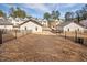 This backyard is surrounded by a black fence offering privacy and security at 857 Athens Dr # 102, Raleigh, NC 27606