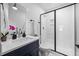 This bathroom features a modern shower, floating vanity, and contemporary fixtures at 857 Athens Dr # 102, Raleigh, NC 27606