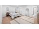 Bright bedroom boasts a neutral palette, ensuite bathroom, and oversized mirror at 857 Athens Dr # 102, Raleigh, NC 27606
