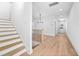 Welcoming entryway with hardwood floors and view of staircase at 857 Athens Dr # 102, Raleigh, NC 27606