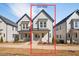 Charming two-story home with craftsman style details and a covered front porch at 857 Athens Dr # 102, Raleigh, NC 27606