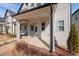 Inviting front porch with craftsman style front door at 857 Athens Dr # 102, Raleigh, NC 27606