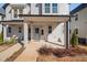 Inviting front porch and craftsman style front door at 857 Athens Dr # 102, Raleigh, NC 27606