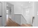 Second floor hallway with hardwood flooring and recessed lighting at 857 Athens Dr # 102, Raleigh, NC 27606