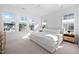 Bright main bedroom featuring large windows, a comfortable bed, and modern decor at 857 Athens Dr # 102, Raleigh, NC 27606