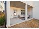 Covered patio with outdoor seating, perfect for entertaining or relaxing at 857 Athens Dr # 102, Raleigh, NC 27606