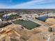 Aerial view showcasing a lakefront community, nearby shopping centers and residential development at 88 Antler Steel Dr, Clayton, NC 27527