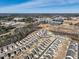Aerial view of a residential area with newly built homes, lakes, and commercial buildings at 88 Antler Steel Dr, Clayton, NC 27527