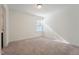 Sunlit bedroom with neutral carpet and a window, offering a blank canvas for personalization at 88 Antler Steel Dr, Clayton, NC 27527
