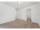Bedroom featuring neutral carpet, white walls, and multiple entryways, offering a customizable space at 88 Antler Steel Dr, Clayton, NC 27527