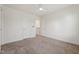 Bedroom featuring neutral carpet, white walls, a ceiling fan, and multiple doors leading to other rooms at 88 Antler Steel Dr, Clayton, NC 27527
