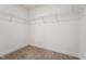 Walk-in closet with shelving and neutral carpet, offering ample storage space at 88 Antler Steel Dr, Clayton, NC 27527