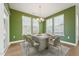 The dining room features an elegant table set with a marble top and modern chairs at 88 Antler Steel Dr, Clayton, NC 27527