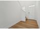 Bright entryway featuring hardwood floors, a white door and staircase at 88 Antler Steel Dr, Clayton, NC 27527