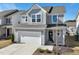 Charming two-story home with gray siding, a two-car garage, and manicured landscaping at 88 Antler Steel Dr, Clayton, NC 27527