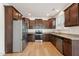 Well-equipped kitchen features stainless appliances, granite counters and ample wood cabinetry at 88 Antler Steel Dr, Clayton, NC 27527