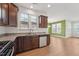Kitchen has stainless appliances, granite countertops and ample wood cabinets. Open to living area at 88 Antler Steel Dr, Clayton, NC 27527