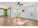 Bright living room features hardwood floors, a ceiling fan, and ample natural light at 88 Antler Steel Dr, Clayton, NC 27527