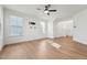 Bright living room features hardwood floors, a ceiling fan, and ample natural light at 88 Antler Steel Dr, Clayton, NC 27527