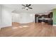 Open-concept living space with hardwood floors seamlessly connecting living and kitchen areas at 88 Antler Steel Dr, Clayton, NC 27527