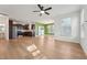 Open-concept living space with hardwood floors seamlessly connecting living and kitchen areas at 88 Antler Steel Dr, Clayton, NC 27527
