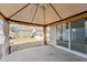 Covered patio area with sliding glass doors leading to the home and a view of the backyard at 88 Antler Steel Dr, Clayton, NC 27527