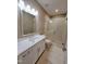 Bathroom features modern vanity with stone counter and glass shower at 98102 Drummond, Chapel Hill, NC 27517