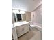 Well-lit bathroom with a white vanity, framed mirror, and tiled shower-tub combination at 98102 Drummond, Chapel Hill, NC 27517