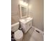 Bathroom features modern vanity with stone counter and tile floors at 98102 Drummond, Chapel Hill, NC 27517