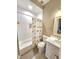 Bathroom with tub, shower and modern single sink vanity at 98102 Drummond, Chapel Hill, NC 27517
