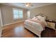 Bright bedroom features hardwood floors, lots of natural light, and a queen bed at 98102 Drummond, Chapel Hill, NC 27517