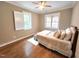 Cozy bedroom with natural light, ceiling fan, and hardwood floors at 98102 Drummond, Chapel Hill, NC 27517