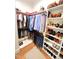 Organized walk-in closet with shelving and hanging racks at 98102 Drummond, Chapel Hill, NC 27517