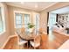 Cozy dining area with a round table, hardwood floors, and natural light is perfect for entertaining at 98102 Drummond, Chapel Hill, NC 27517