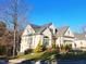 Elegant home showcasing manicured lawn, lush landscaping, and attached garage in a desirable neighborhood at 98102 Drummond, Chapel Hill, NC 27517