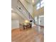 Inviting foyer with a staircase, high ceilings, and hardwood floors at 98102 Drummond, Chapel Hill, NC 27517