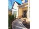 Inviting front entrance features a curved walkway, stone accents, and charming decor for a welcoming approach at 98102 Drummond, Chapel Hill, NC 27517