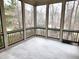 Relaxing screened porch featuring tiled floors and peaceful outdoor views at 98102 Drummond, Chapel Hill, NC 27517