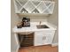 Modern wet bar features wine cooler, marble countertop, and a designer sink at 98102 Drummond, Chapel Hill, NC 27517