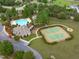 Aerial view of community amenities, including a pool, clubhouse, and tennis courts at 1017 Payton Ct, Raleigh, NC 27614
