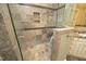 This bathroom features a tile shower with glass doors and a built-in shelf at 1017 Payton Ct, Raleigh, NC 27614
