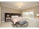 Bedroom with a plush rug, chandelier, and large window with lots of natural light at 1017 Payton Ct, Raleigh, NC 27614