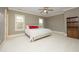 Comfortable bedroom with neutral walls, a ceiling fan, and windows at 1017 Payton Ct, Raleigh, NC 27614