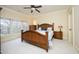 Bright primary bedroom with beautiful furnishings, carpet, and a large window at 1017 Payton Ct, Raleigh, NC 27614