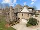 Brick home with three car garage, screened porch and patio, set on a well-manicured lawn at 1017 Payton Ct, Raleigh, NC 27614